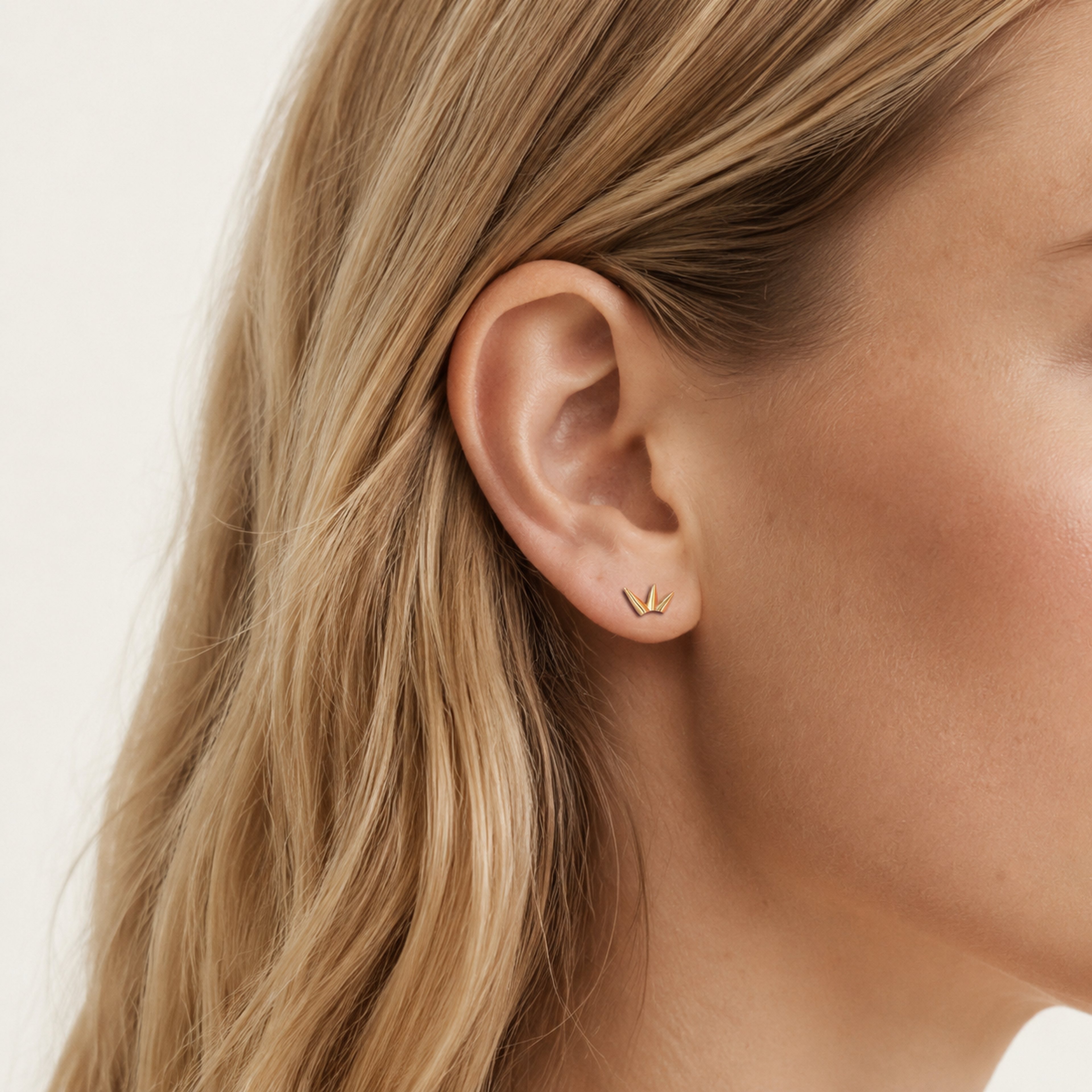 Sterling Silver Bamboo Leaf Stud Earrings worn on the ear