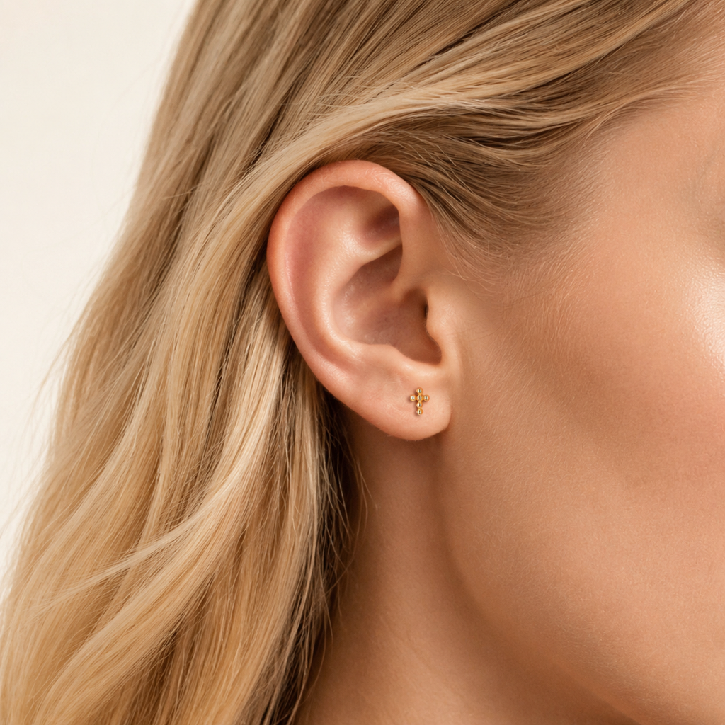 Sterling Silver Polished Cross Stud Earrings worn on the ear
