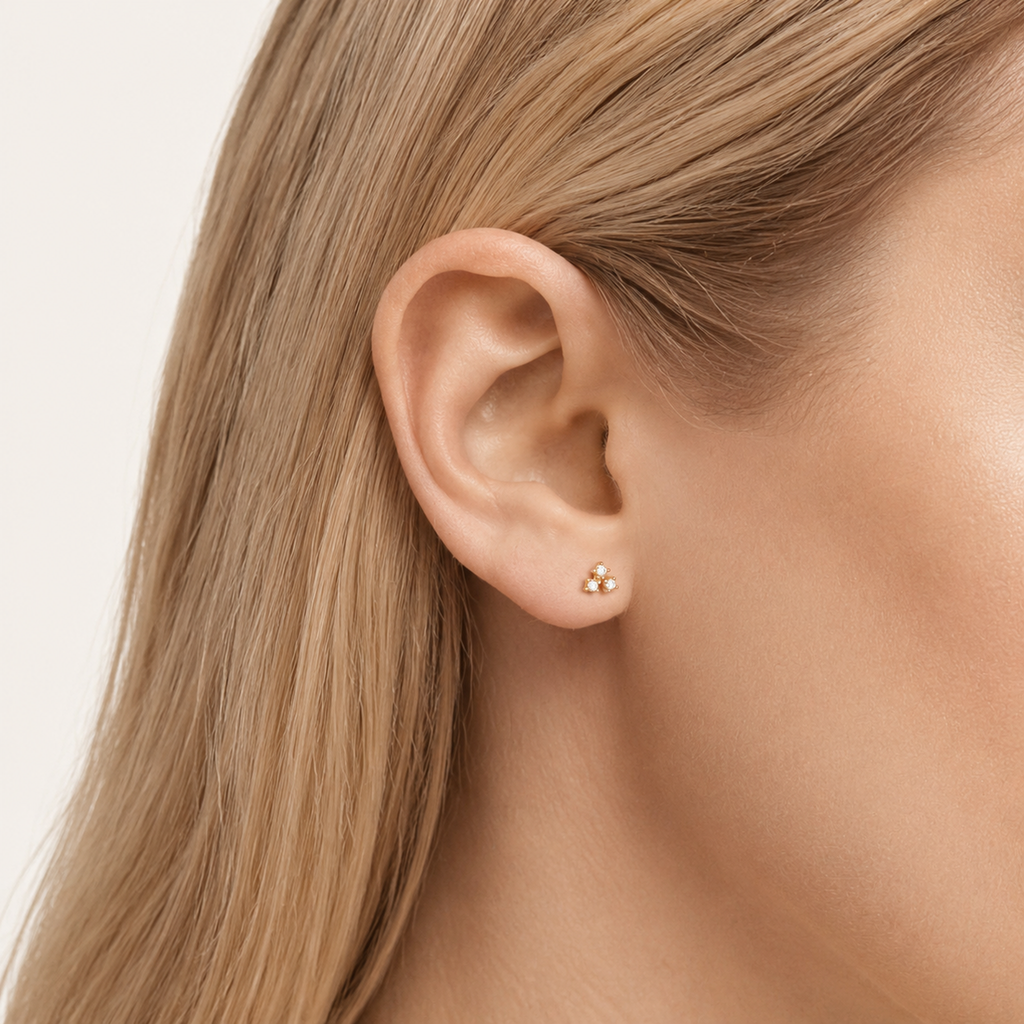Sterling Silver Screw-Back Zirconia Stud Earrings worn on the ear