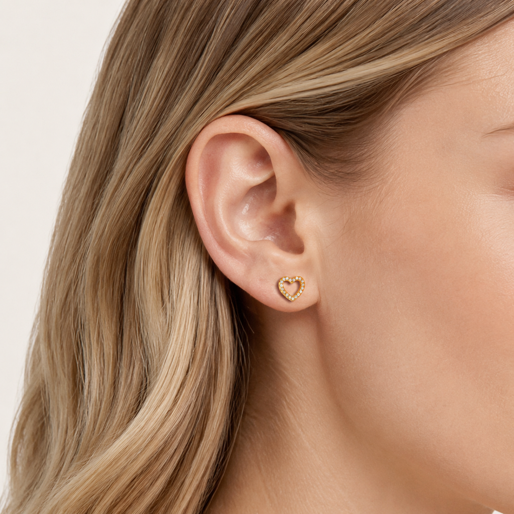 Sterling Silver Zirconia Heart Stud Earrings worn on the ear