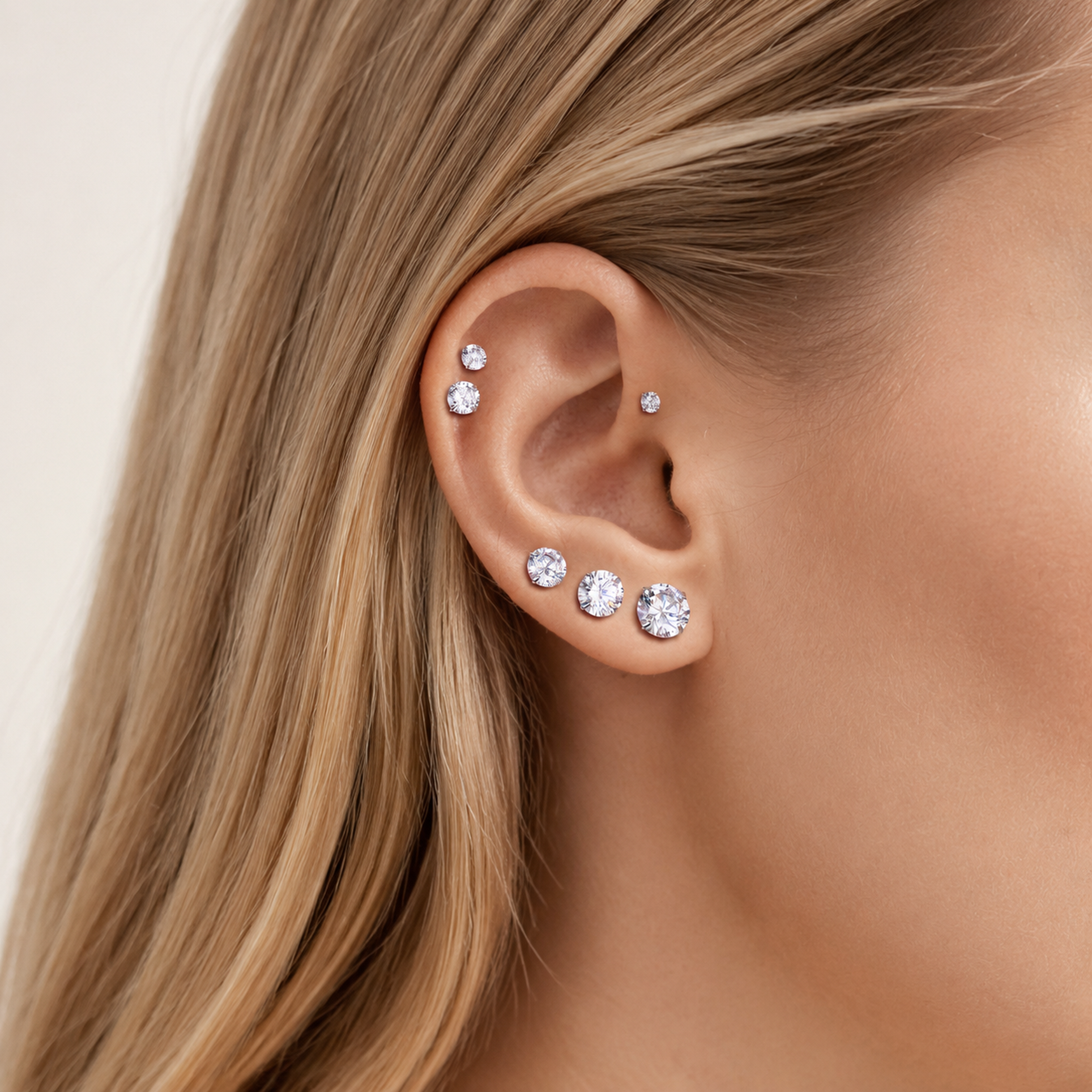Sterling Silver Four-Prong Zirconia Flat Back Earrings worn on the ear