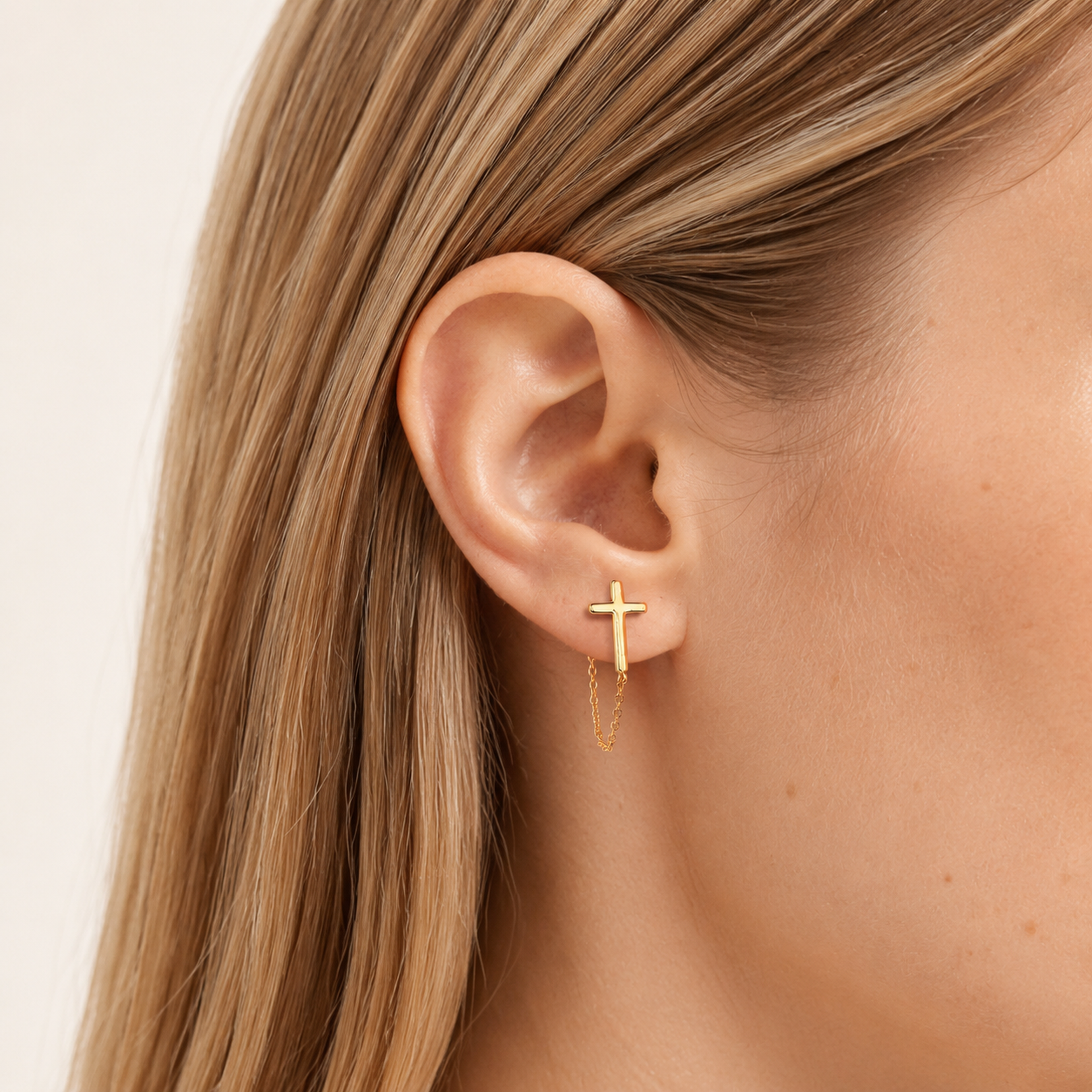 Sterling Silver Cross Chain Drop Stud Earrings worn on the ear