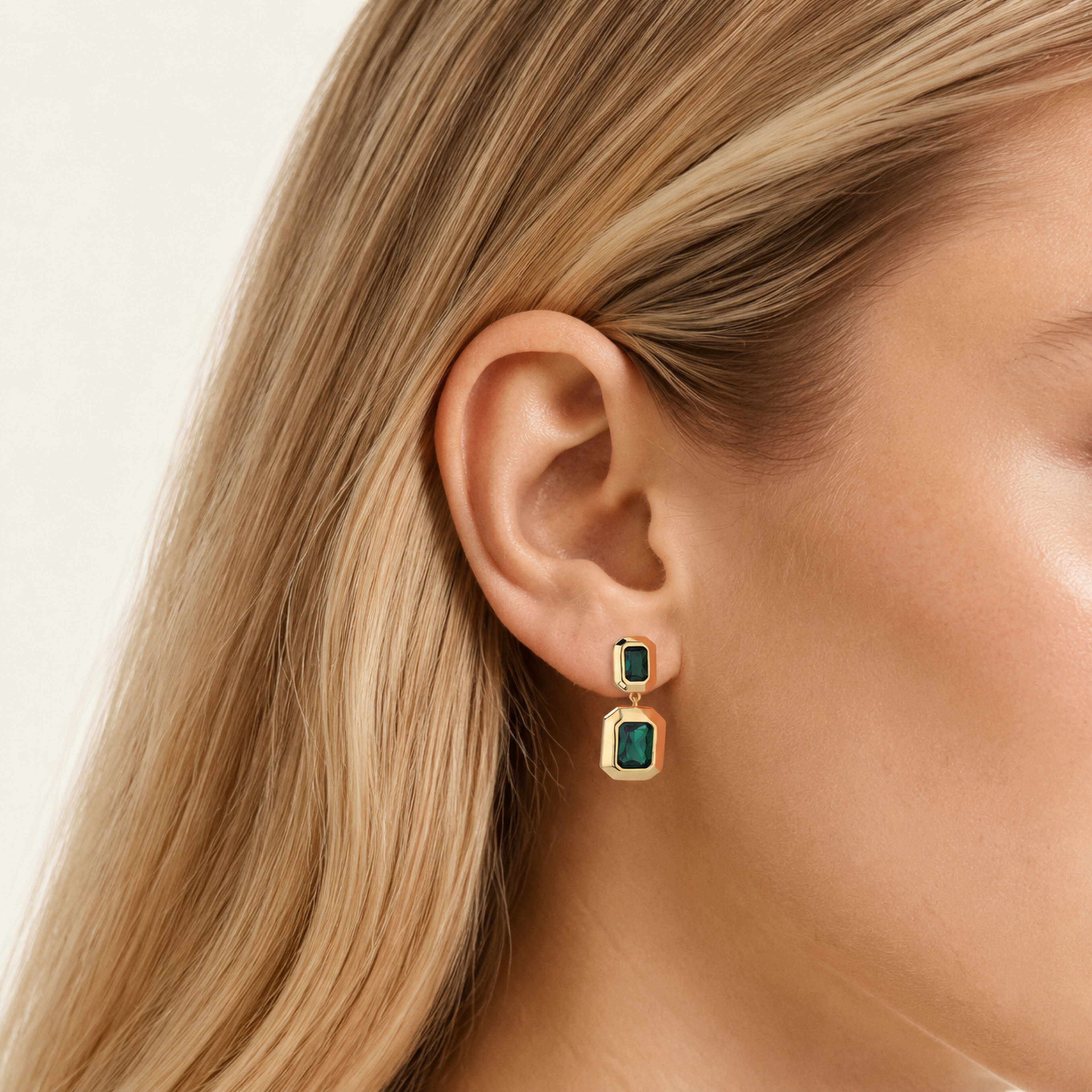 Sterling Silver Emerald-Green Geometric Stud Earrings worn on the ear