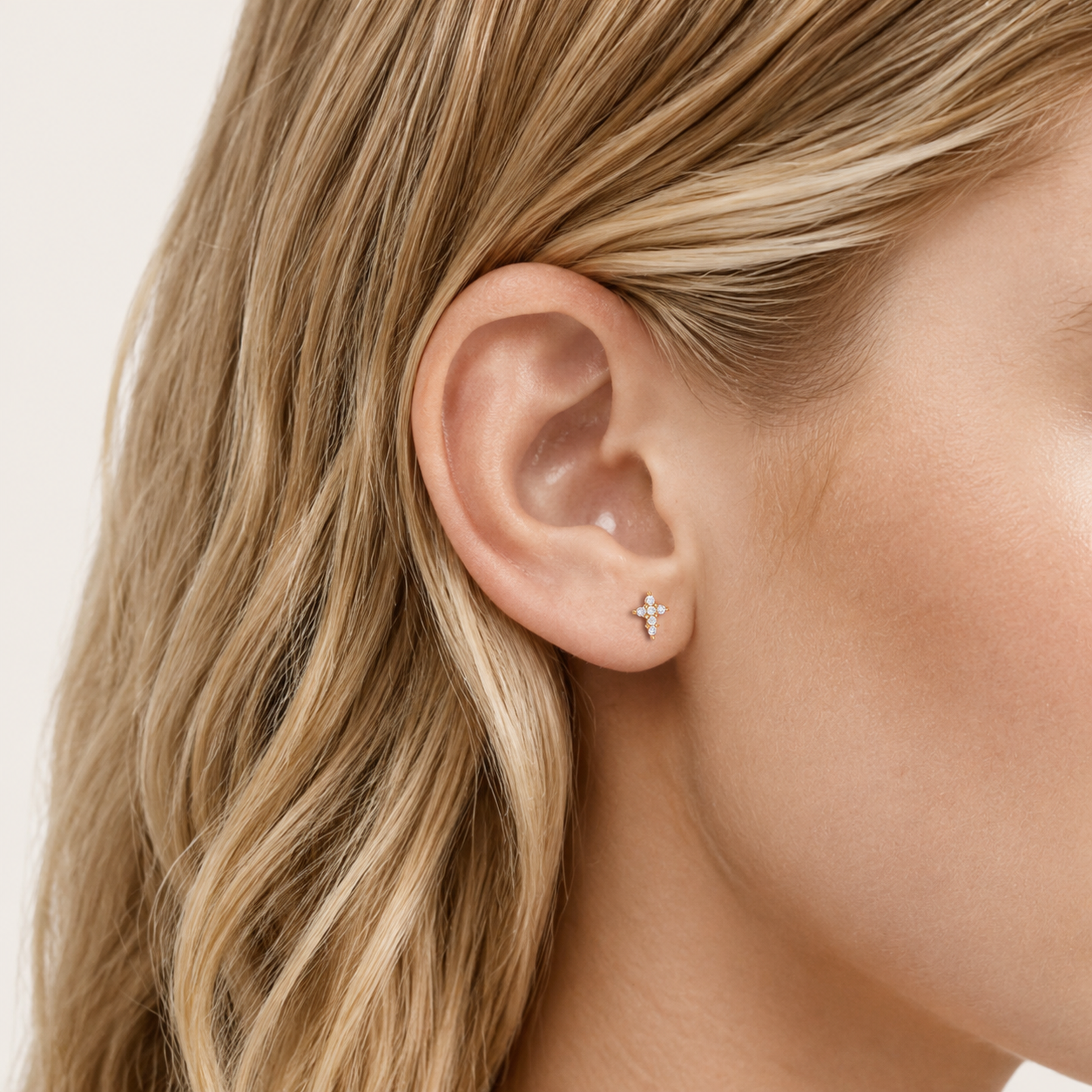Sterling Silver Zirconia Cross Stud Earrings worn on the ear
