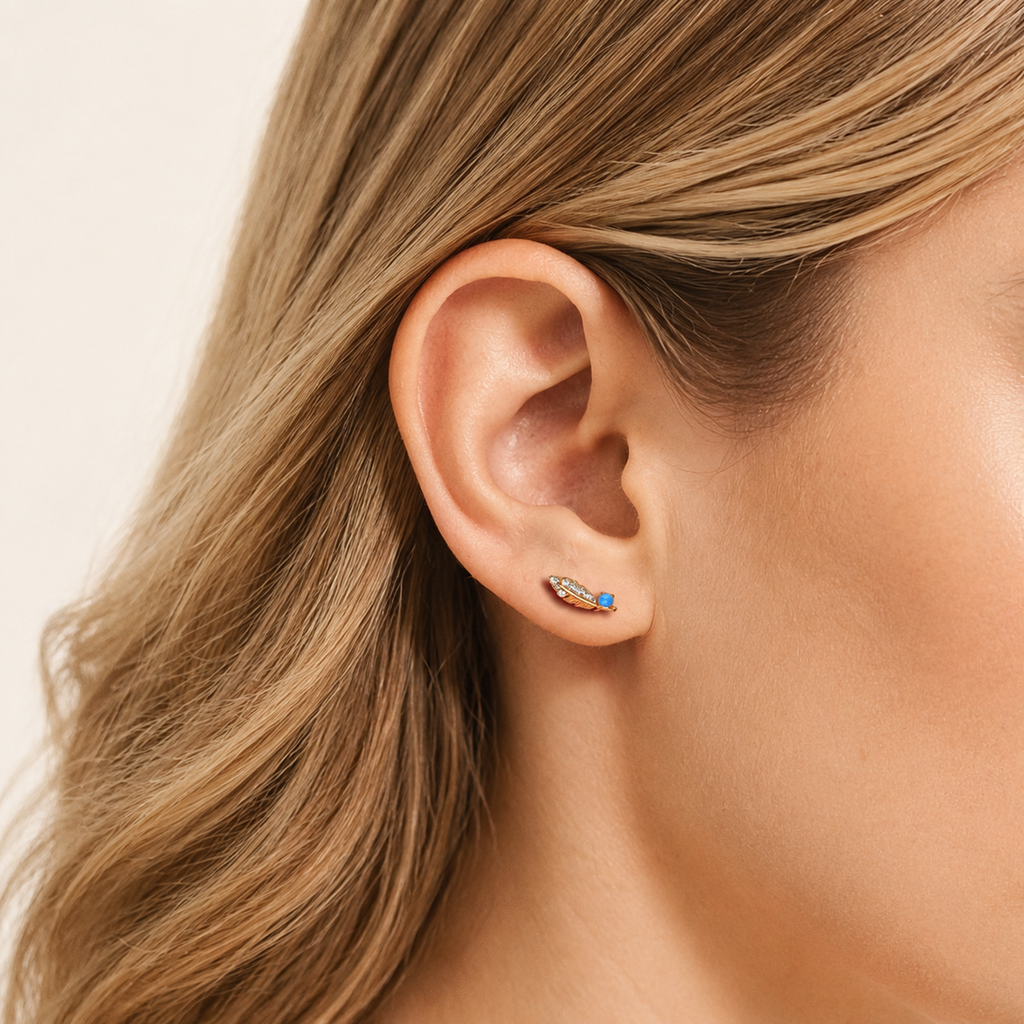 Sterling Silver Opal Feather Stud Earrings worn on the ear