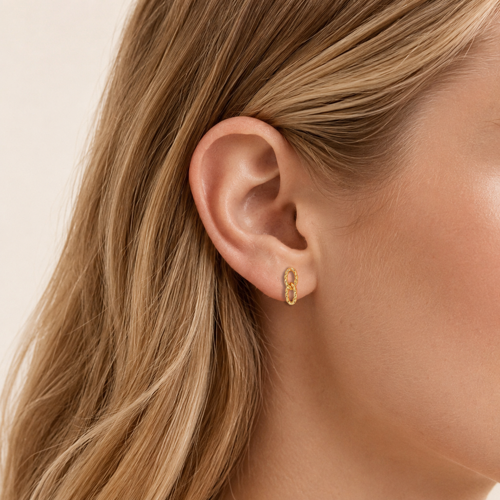 Sterling Silver Twisted Double Ring Stud Earrings worn on the ear