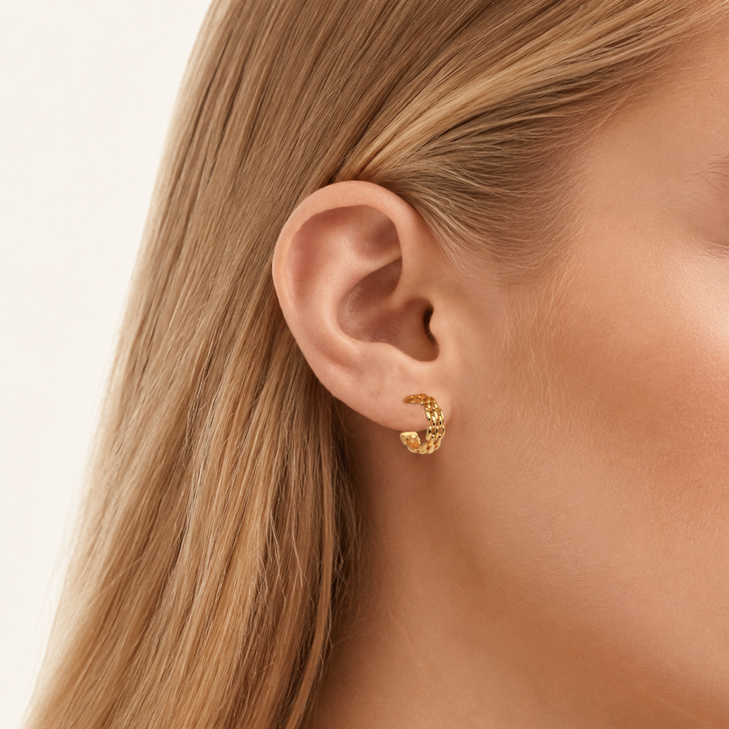 Sterling Silver Braided Twist Circle Stud Earrings worn on the ear