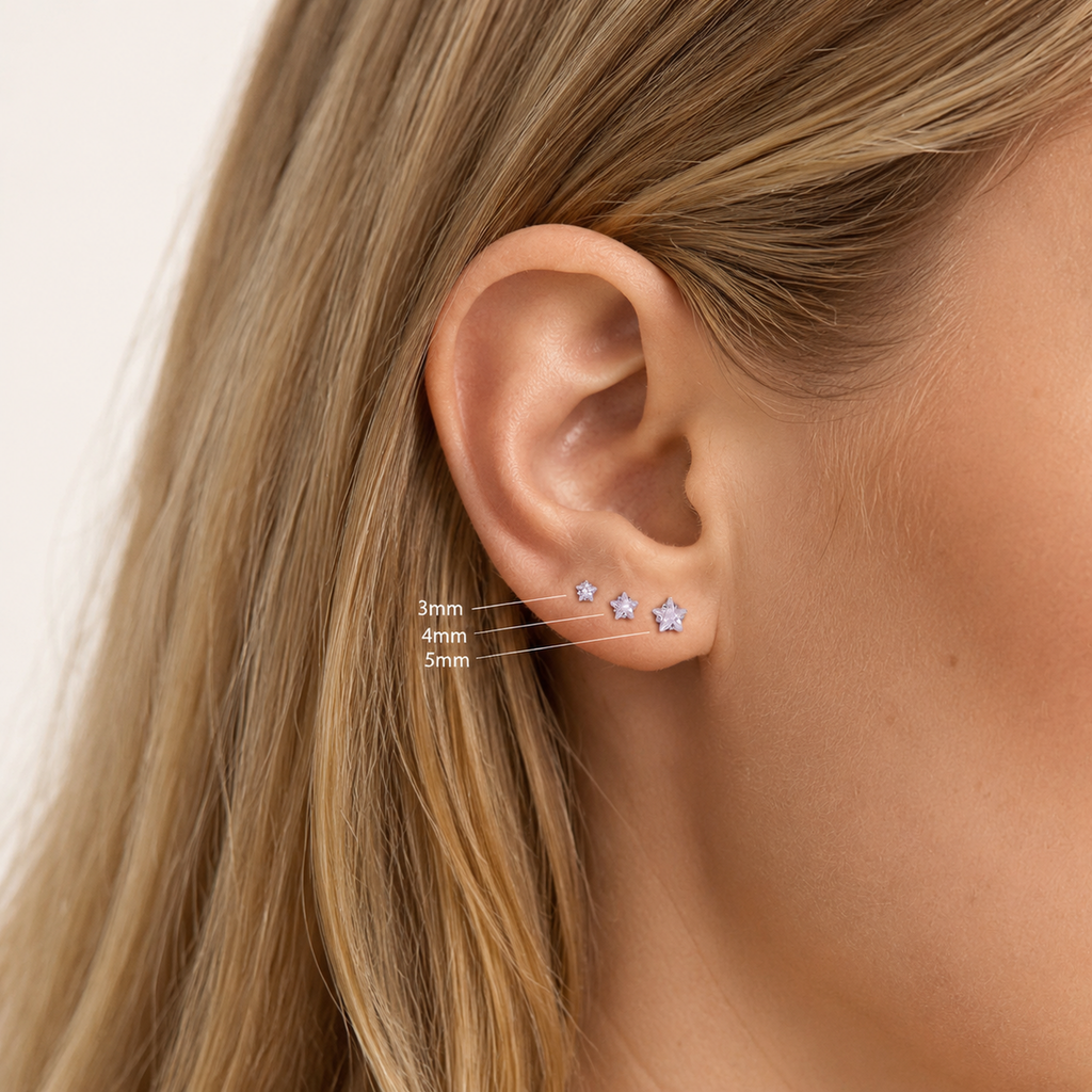 Sterling Silver Five-Point Star Zirconia Flat Back Earrings worn on the ear