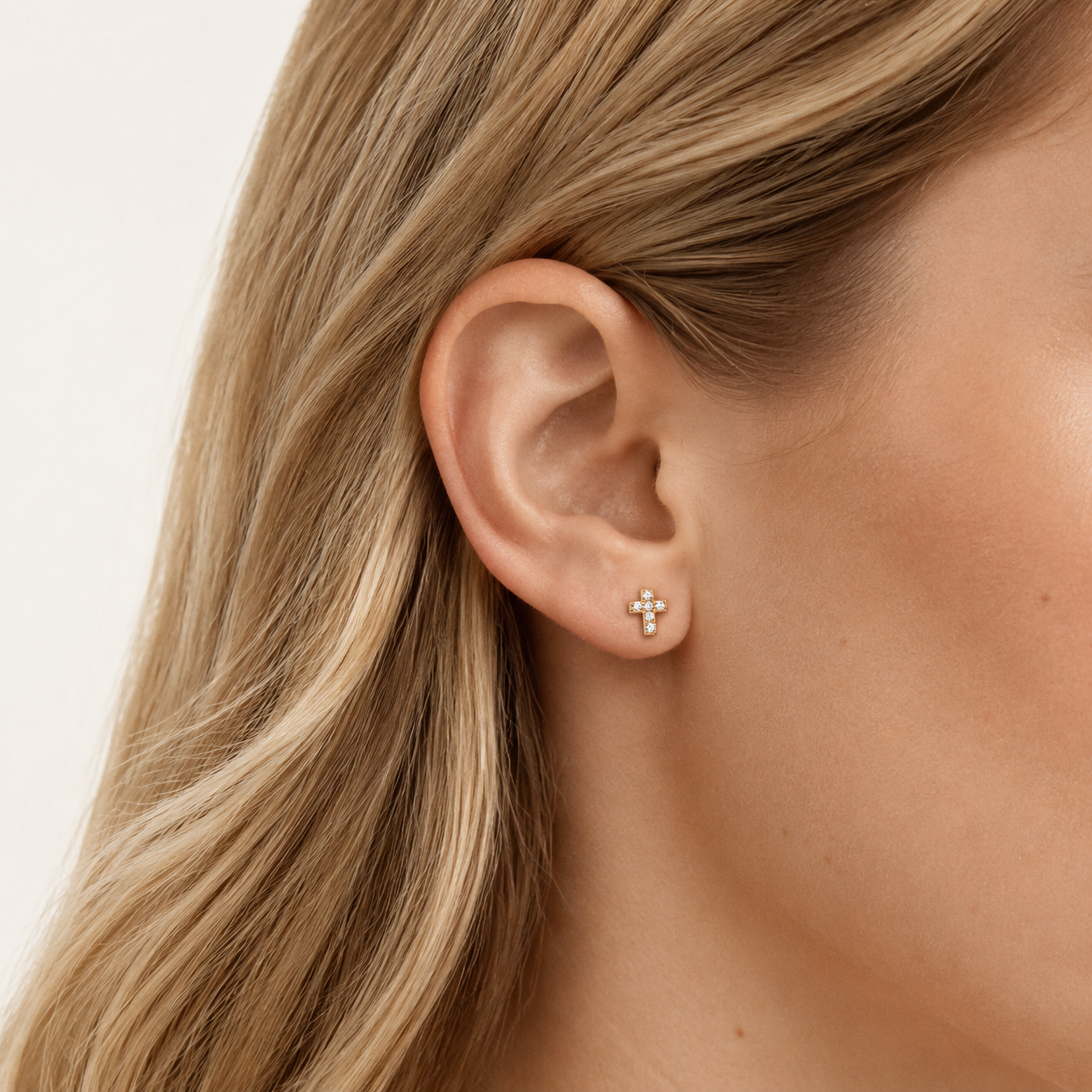 Sterling Silver Cross Zirconia Flat Back Earrings worn on the ear